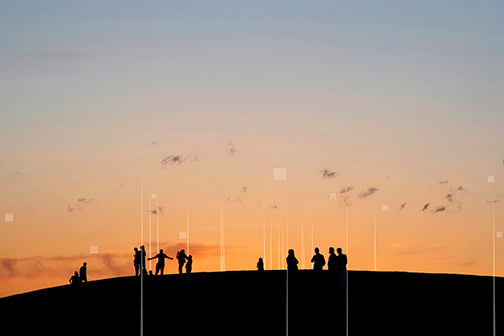Photograph of a sunset with people on a hill, with data overlay of wifi towers and satellites.