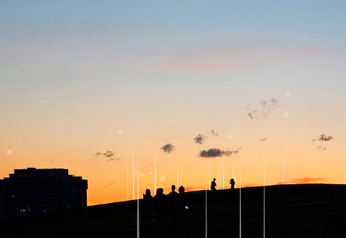 Photograph of a skyline, with data overlay of wifi towers and satellites.