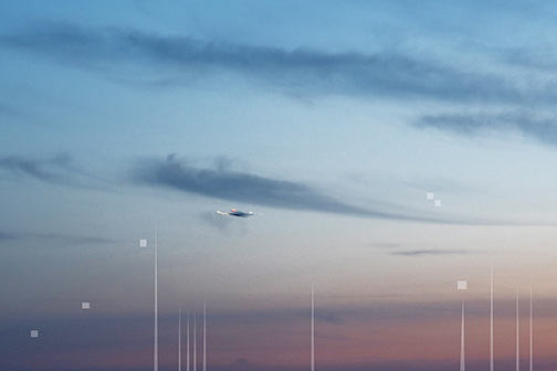 Photograph of a skyline, with data overlay of wifi towers and satellites.